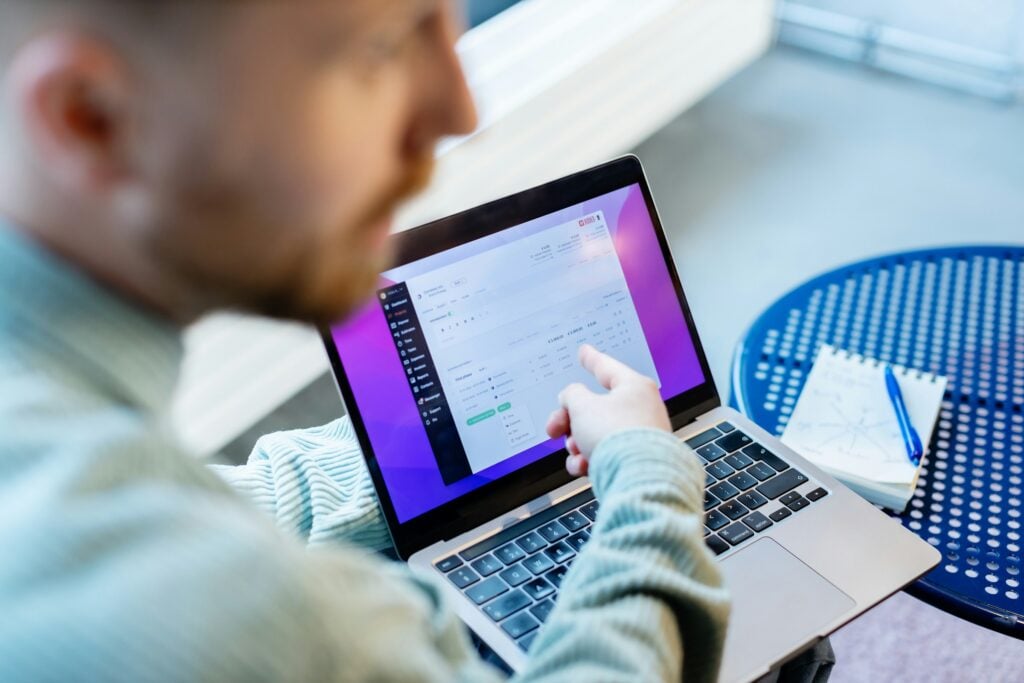 Man Pointing at Laptop - Transfer Ownership Of Google Calendar