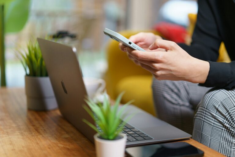 man using a phone - Time Card App For Employees