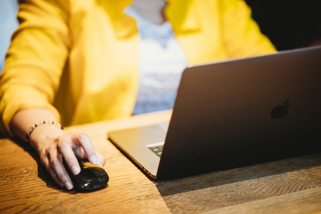woman using a mouse - Invoice for Hours Worked