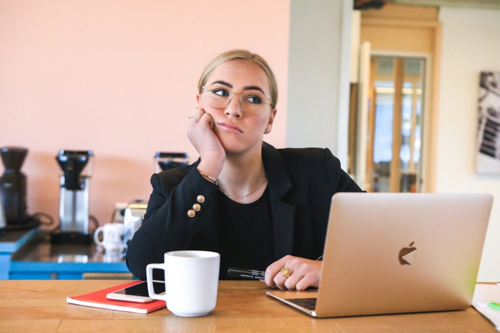 woman thinking - QuickBooks Alternatives