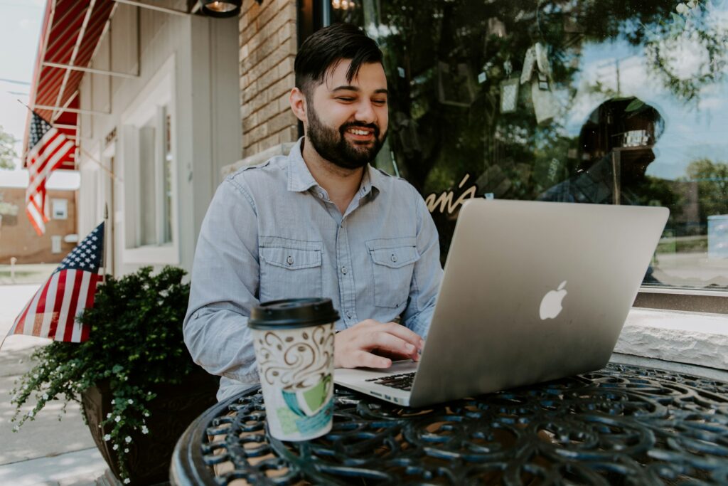 man smiling - FreshBooks Alternatives