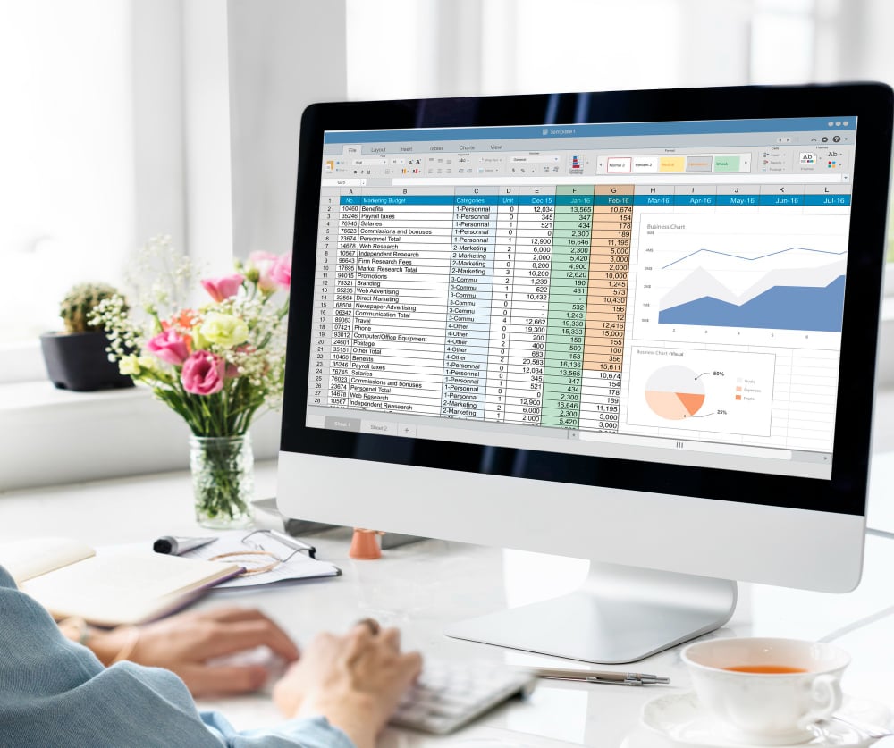 woman wokring on a desktop - Best Agency Project Management Software
