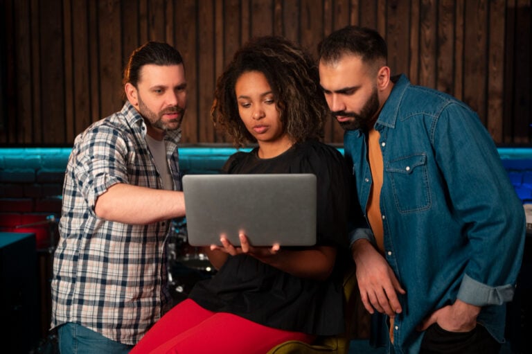 team on a laptop - Monday vs. Asana