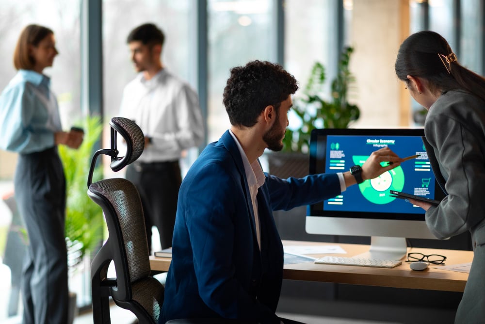 employees in an office - Best Agency Project Management Software