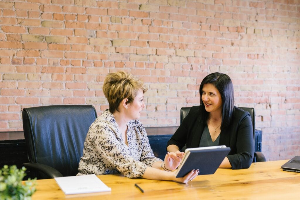 Women Discussing - Freshbooks vs Quickbooks