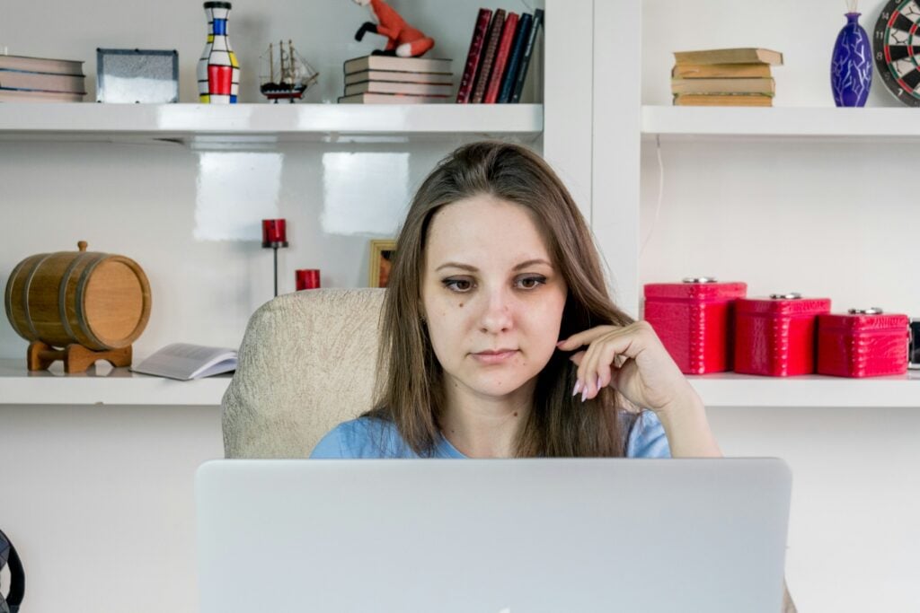 woman using a laptop - Monday vs. Asana