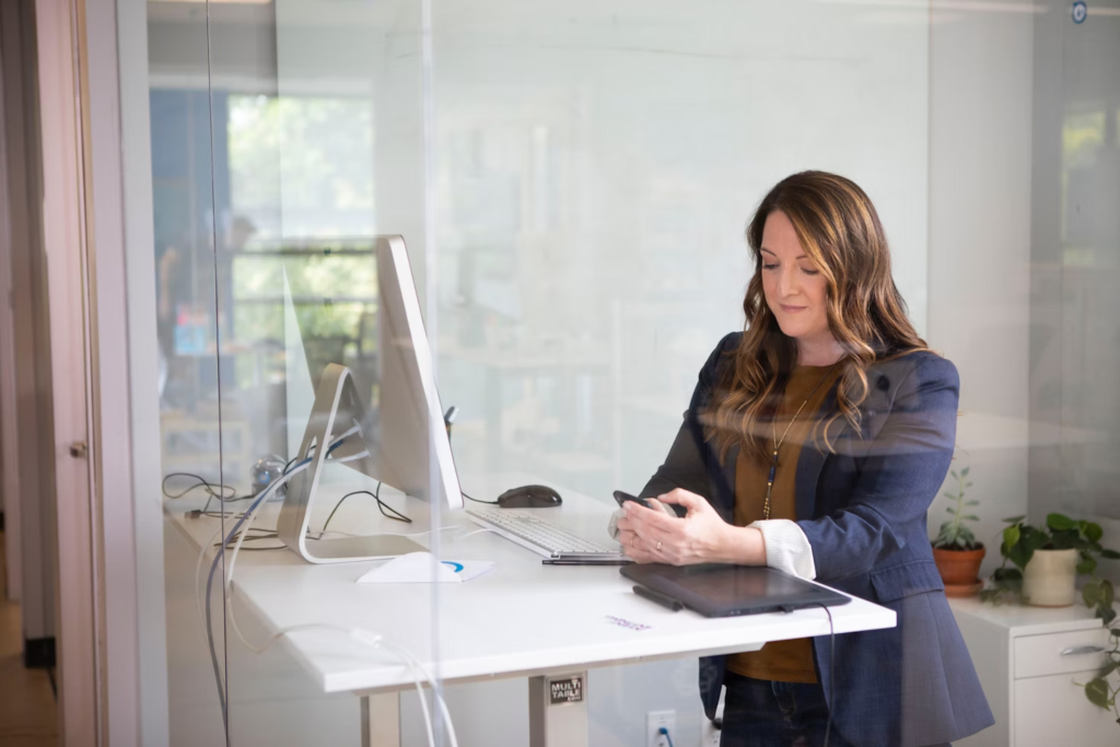 woman using a phone - How to Keep Track of Projects at Work