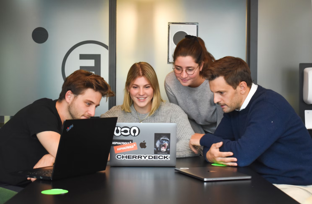 employees in an office - Creative Agency Resource Management