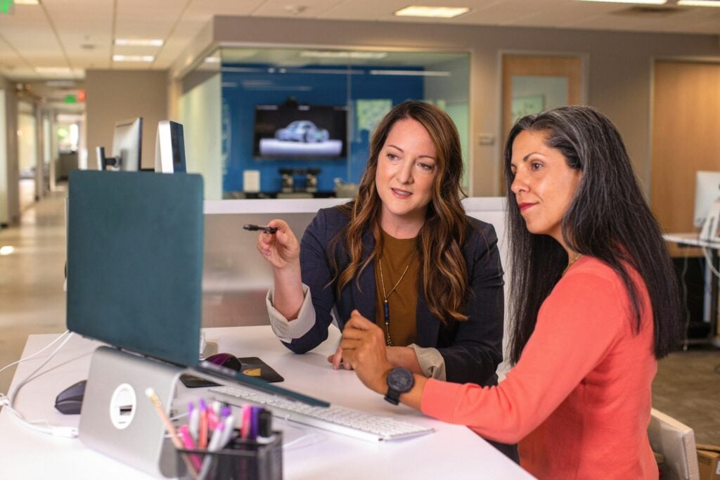 Women Discussing - Freshbooks vs Quickbooks