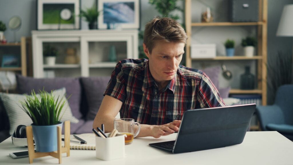 man on a tablet - How Many Work Weeks in a Year