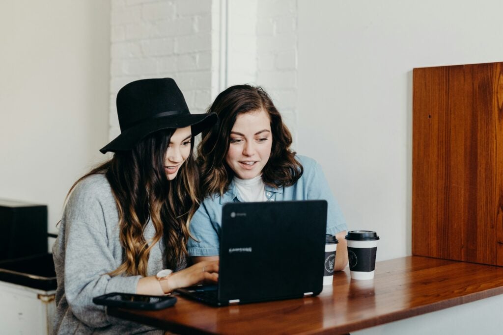 employees using laptop - How Many Saturdays Are in a Year