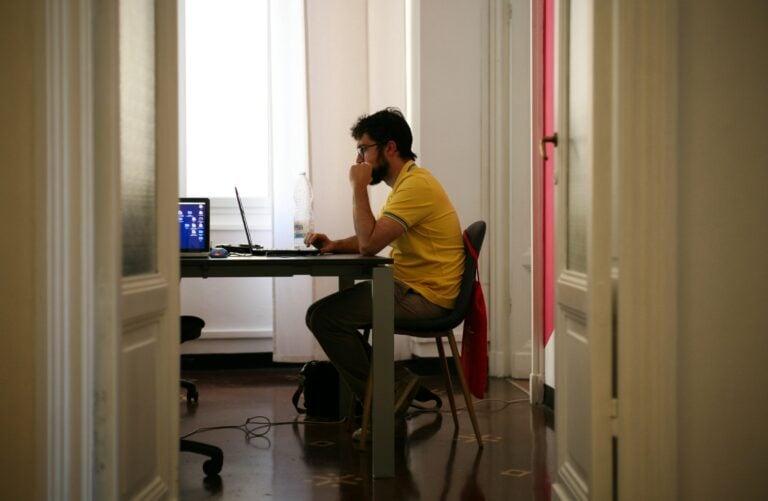 Person Working on Laptop - How Many Working Hours Are in a Month