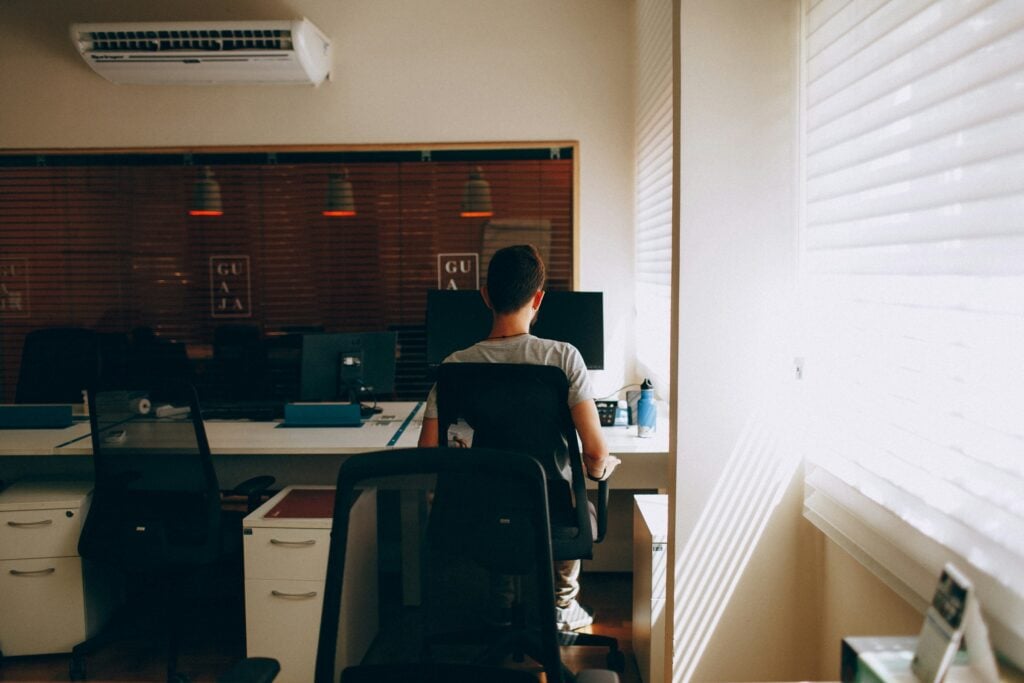 Person Working in Office - How Many Working Hours Are in a Month