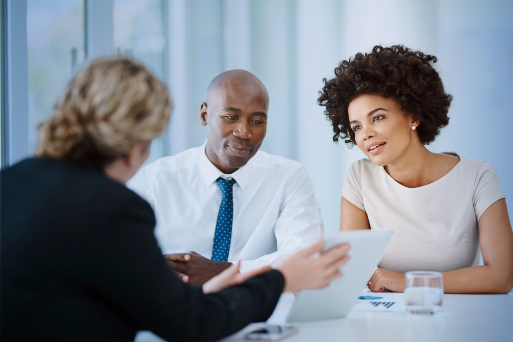 employees conducting an interview - Leadership Interview Questions