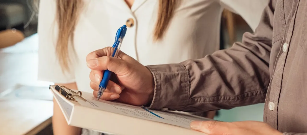 man writing - Team Lead Interview Questions