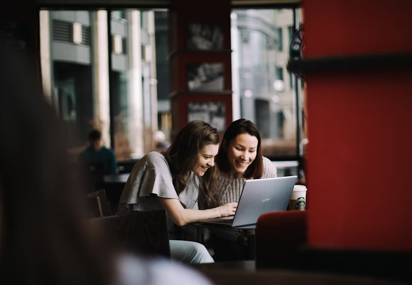 women in a cafe using a laptop - Cute Friday Memes
