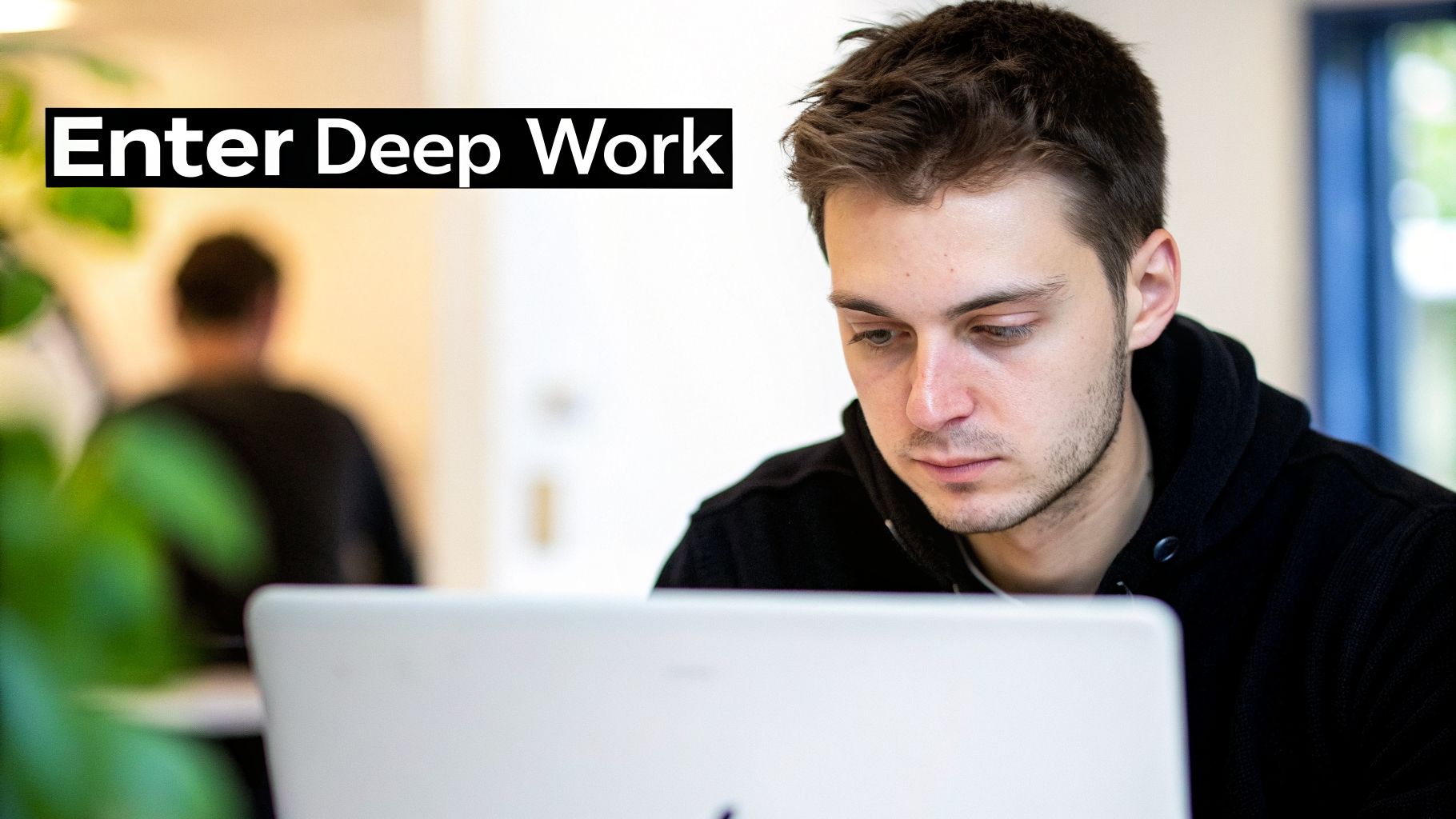 A focused young man with a slight beard intently looking at a laptop screen, with 'Enter Deep Work' text.