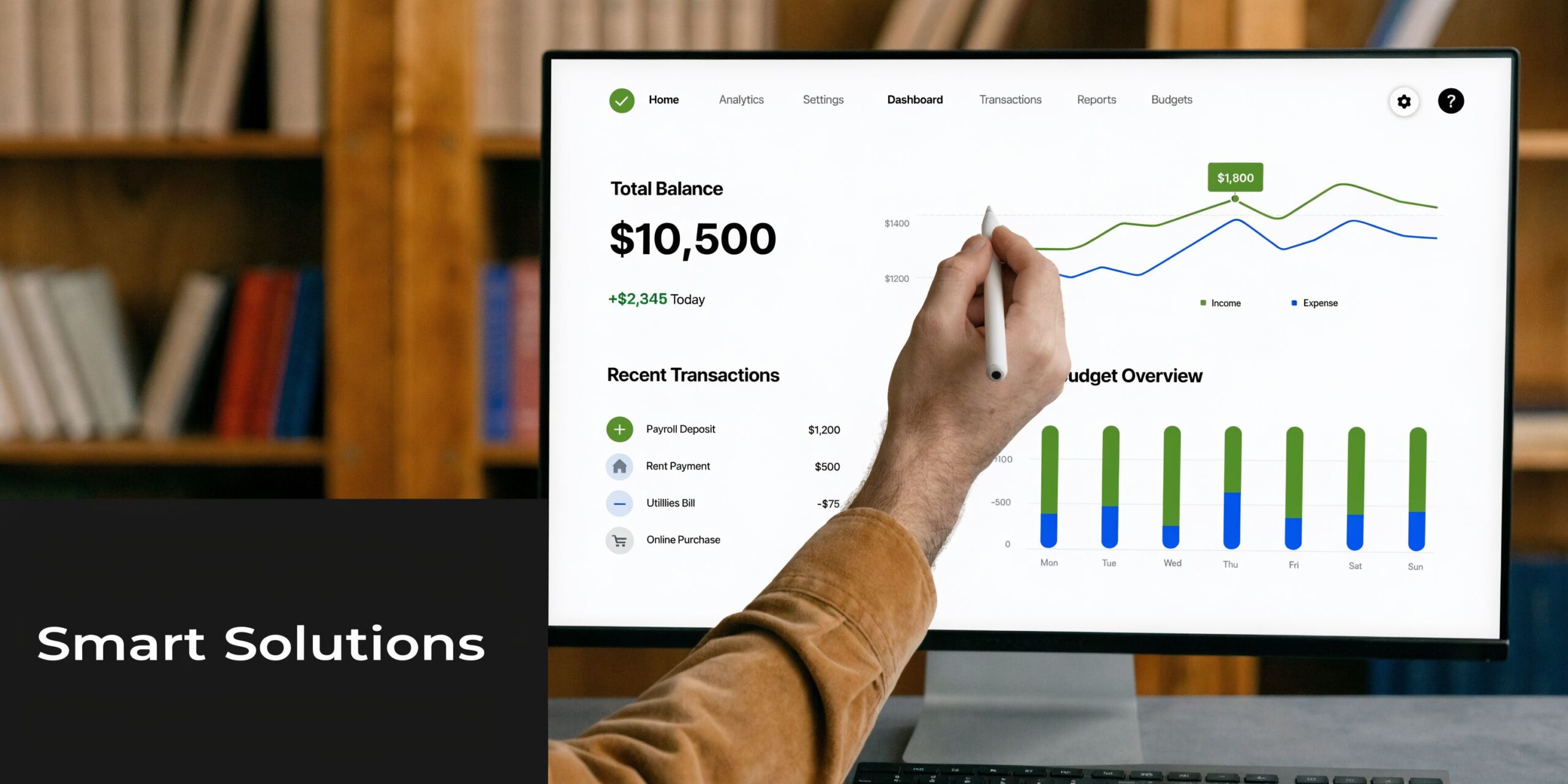A person using a stylus on a computer screen displaying financial charts and transaction data dashboard.
