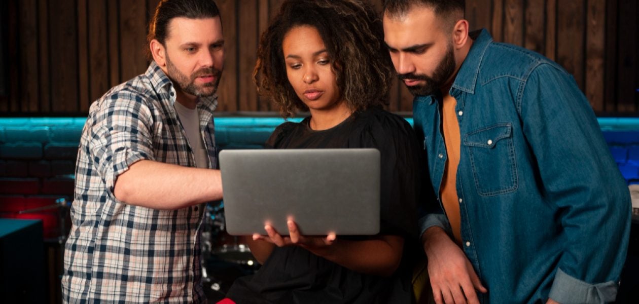 team on a laptop - Monday vs. Asana