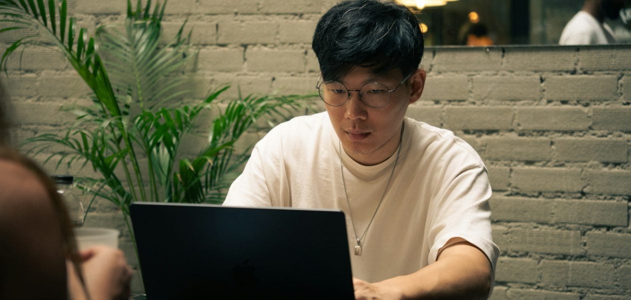 man doing work on a laptop - Monday.com vs Basecamp
