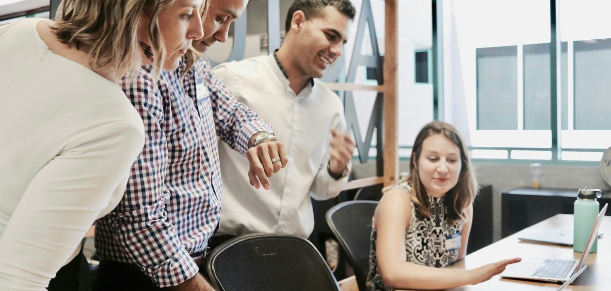 employees in an office - How to Keep Track of Projects at Work