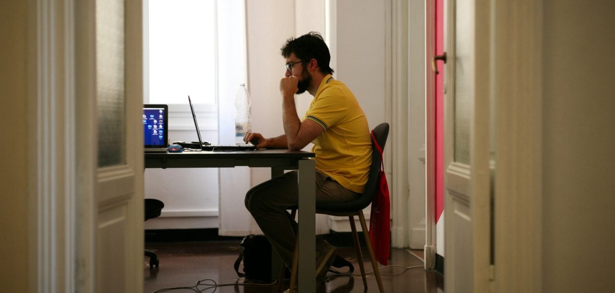 Person Working on Laptop - How Many Working Hours Are in a Month