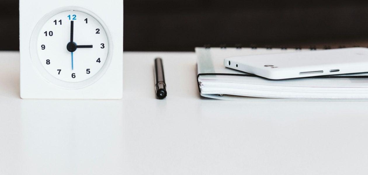 clock on a desk - Keeping Track Of Time At Work