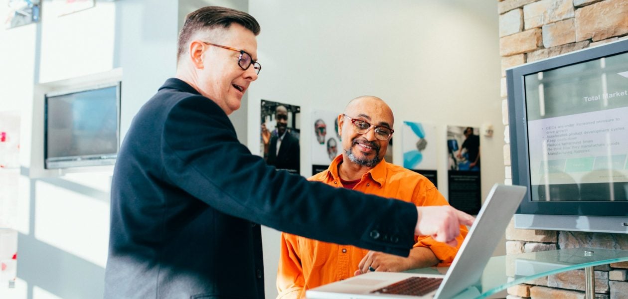 man with a laptop - Accelo Alternatives